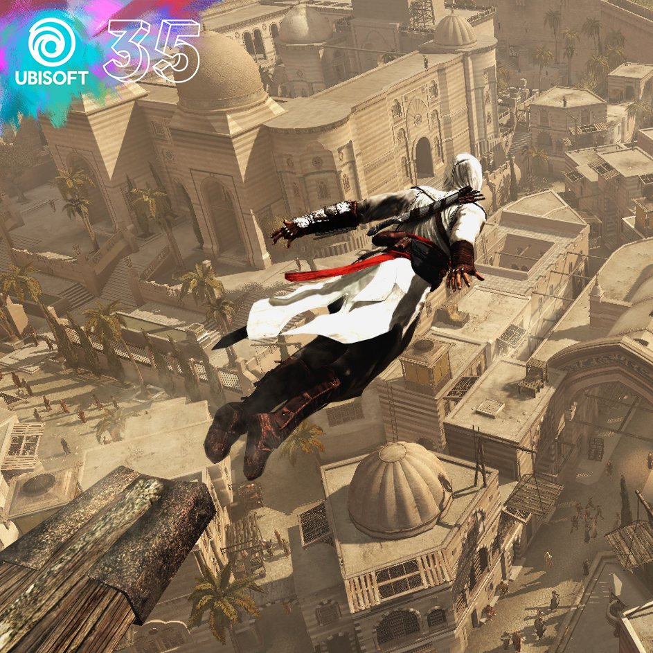 An image from an upward angle looking down on an Assassin, Altair, as he performs a leap of faith. Altair is in mid leap, his arms stretched behind him while a dusty city stretches out beneath him. In the top left is a colourful Ubisoft 35 stamp, indicating it is a part of the 35th anniversary celebration. 