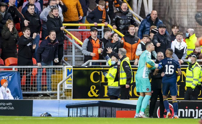 Funso Ojo walking away from Dundee fans