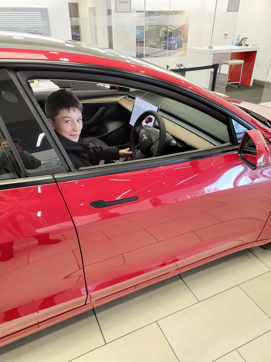 Got a very happy 13 year old today, the staff were fantastic <a href="/Tesla/">Tesla</a> in Birmingham today. Knowing I can't afford one with my midwife wage they made sure my tesla mad son enjoyed his experience and also sorted us a test drive 👏 I now have a new favourite car 😄 <a href="/elonmusk/">Elon Musk</a>