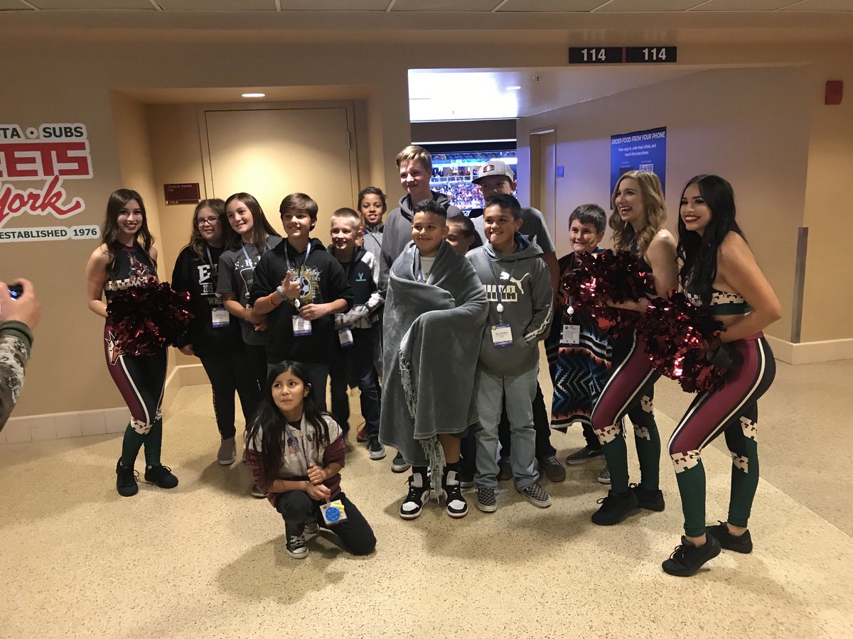Gaughey15John's tweet photo. RVMS FBLA students having their pictures taken with the Arizona Coyotes cheer squad during the FBLA on Ice program. #CTE692 https://t.co/JsrPeL7g9h