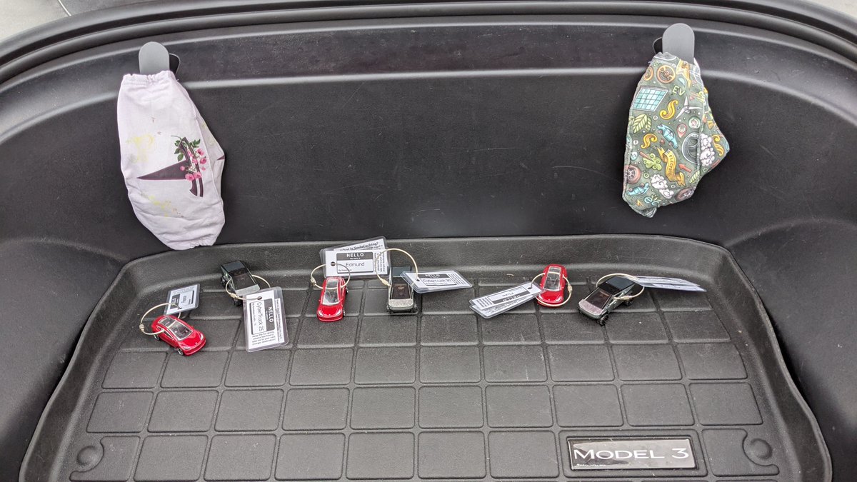 iamitgirlinkc's tweet photo. First @teslacaching trip after 56K miles we're finally starting it. Have my @TeslaDivas mask and my EV mask on the mask holders and the #teslacaching cars to start their journey. Let's go 42! https://t.co/yxjUNR4Bj0