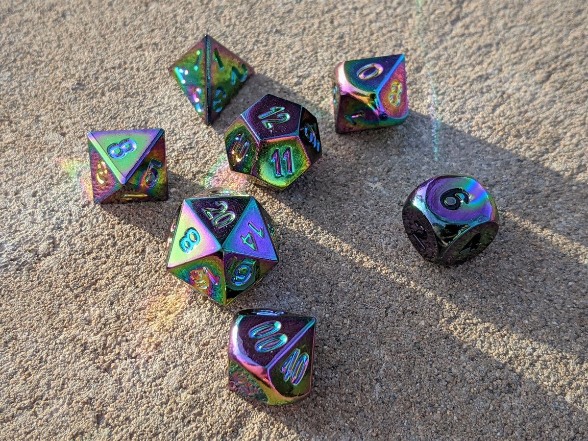 DropTheDie's tweet photo. 🍀Dice Giveaway!👻

The Ghost of Christmas Past offers you these original @DieHardDice Scorched Rainbow metal dice.

NO LONGER FOR SALE, these hefty sweethearts can bring a rainbow to your games year round.

Follow + Like + Retweet to enter! 
Comments welcome :D
Rules below ⬇️ https://t.co/GkYyrozI7D