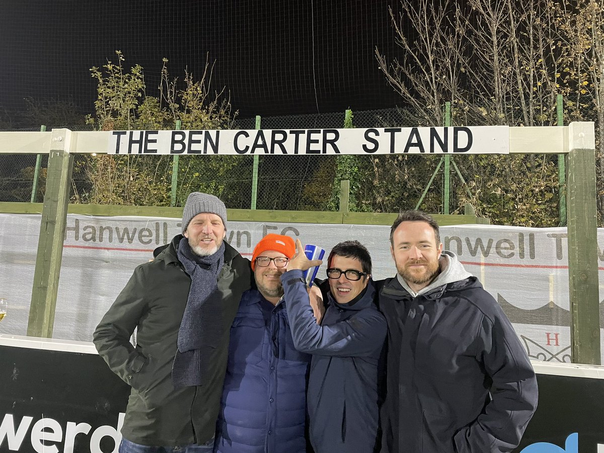 hanwelltownfc's tweet photo. Introducing… 
✨ THE BEN CARTER STAND✨
During lockdown we ran a competition to win the name of one of our stands for a season.
Ben won and, of course, named it after himself! 
Thanks for coming down to ‘open’ your stand Ben! 🖤🤍 https://t.co/mLtLCyfla7