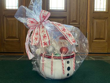 Get your raffle tickets for this holiday basket at our Donate and Paint on December 1st. Includes a $25 gift certificate for Catherine’s Christmas, a Dancing Santa and more holiday decorations in this festive snowman basket.