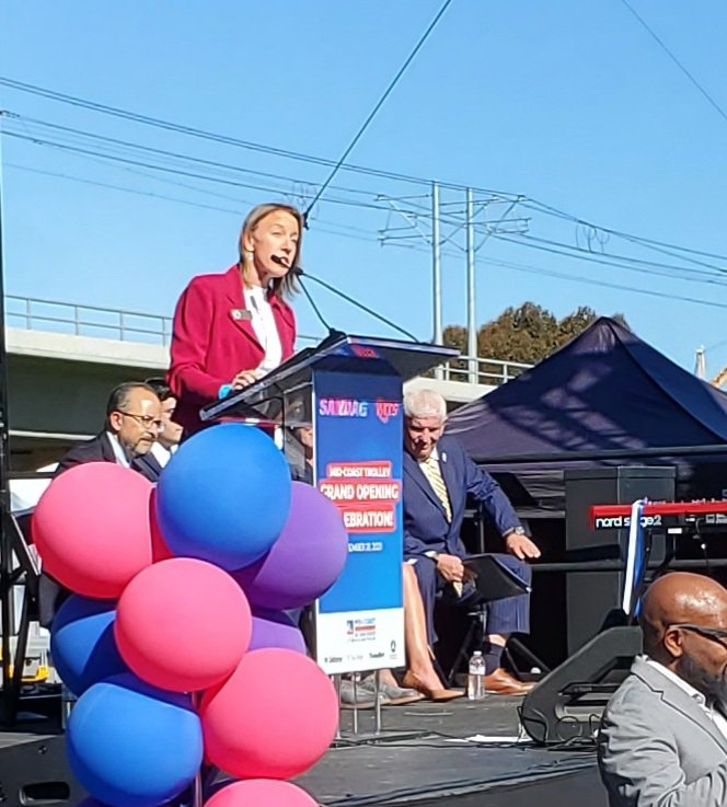 peterpeyser's tweet photo. @SANDAG Chair Mayor Catherine Blakespear @Cblakespear revs up the crowd at opening of Mid-Coast Trolley Extension in San Diego. @sdmts https://t.co/id0uszmWhC