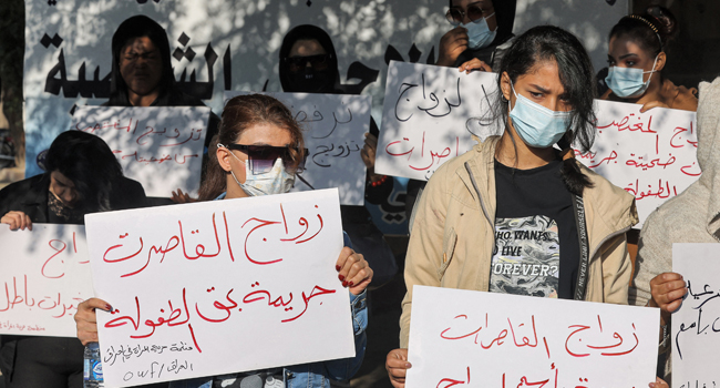 Women protest against the legalisation of a marriage contract for a 12-year-old girl, near the Kadhimiya court in Iraq’s capital Baghdad, Nov. 21, 2021 (Photo: Ahmad Al-Rubaye/AFP/Channels TV)