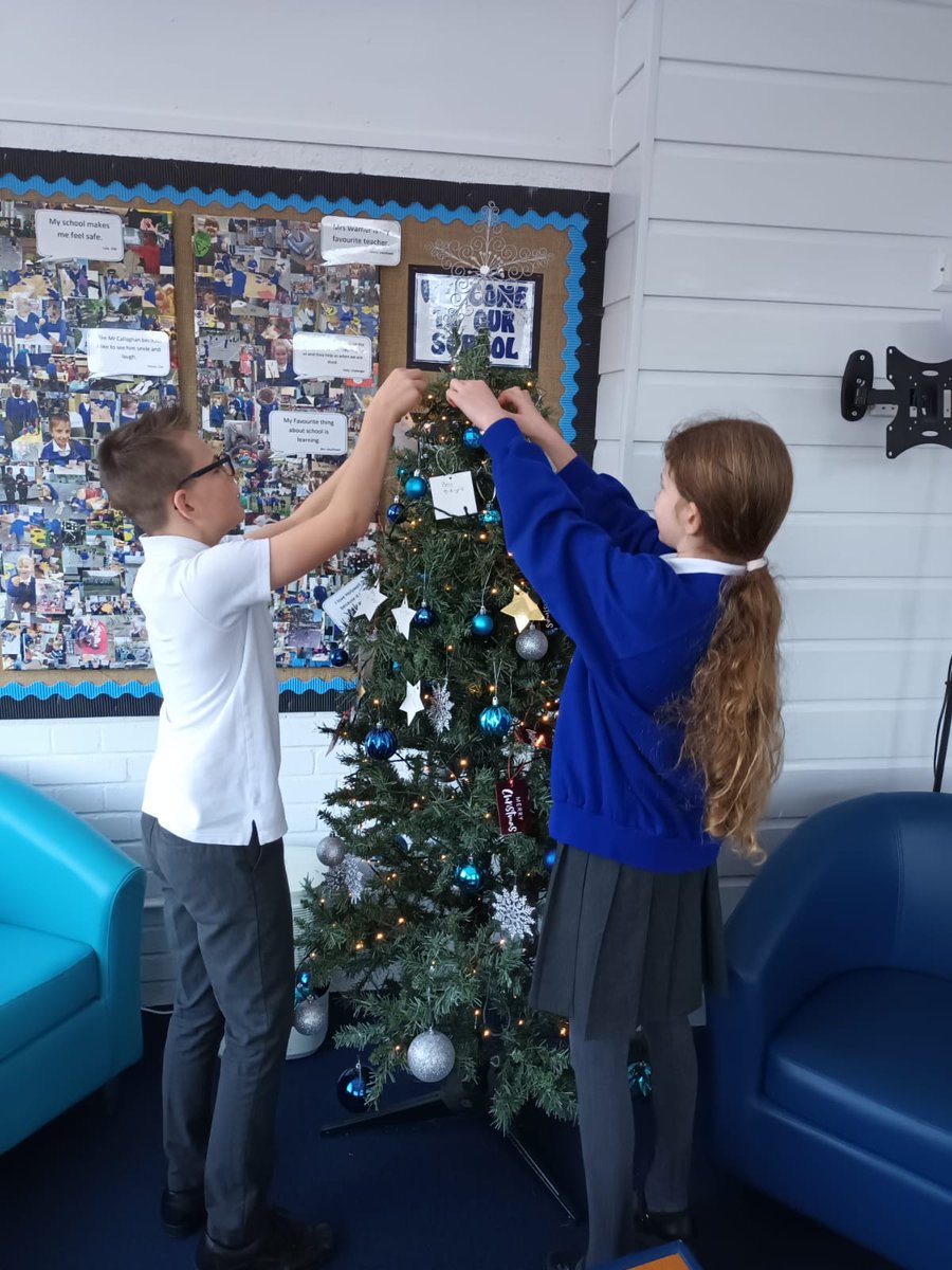 EKCSchoolsTrust's tweet photo. SchoolHolywell: The year 6 lead ambassadors have been busy hanging the tags for Holywells #justgivingtree our aim id to make Christmas magical for as many people as we can. The tags are ready to be taken and exchanged for gifts for a child in need. https://t.co/sxqbmL4aZ4
