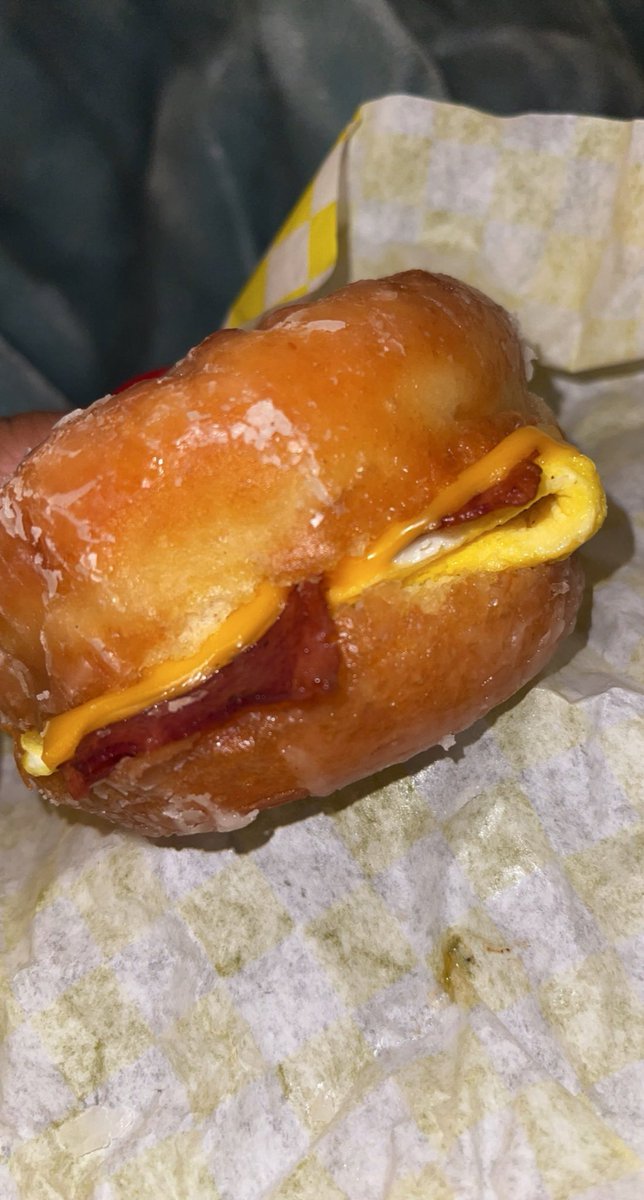 Nun eating a Turkey egg n cheese on a donut <a href="/TonysDonuts/">Tony's Donuts & Cafe</a>