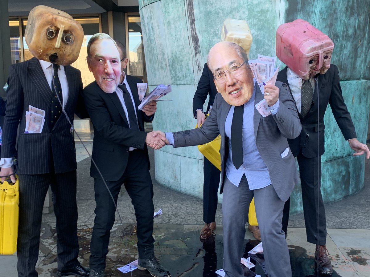 oceanrebellion's tweet image. A few pictures of our dirty, oily action in front of the @UN @IMOHQ today. IMO is holding an important environment meeting today &amp;amp; our 'oil heads' representing industry lobbying of IMO vomited black "oil" on the ground, spread dirty "money" all around for #climate #greenwashing.
