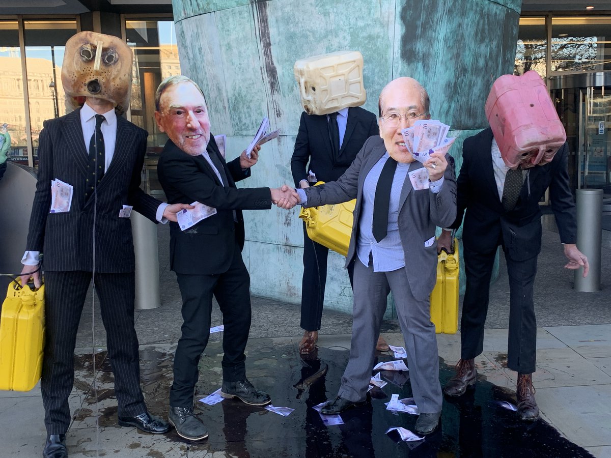oceanrebellion's tweet image. A few pictures of our dirty, oily action in front of the @UN @IMOHQ today. IMO is holding an important environment meeting today &amp;amp; our 'oil heads' representing industry lobbying of IMO vomited black "oil" on the ground, spread dirty "money" all around for #climate #greenwashing.