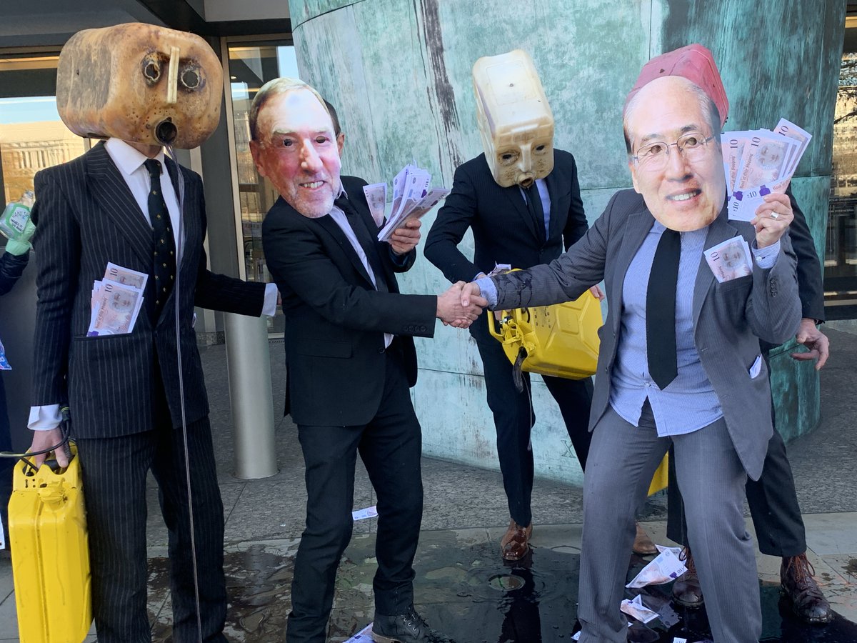 oceanrebellion's tweet image. A few pictures of our dirty, oily action in front of the @UN @IMOHQ today. IMO is holding an important environment meeting today &amp;amp; our 'oil heads' representing industry lobbying of IMO vomited black "oil" on the ground, spread dirty "money" all around for #climate #greenwashing.