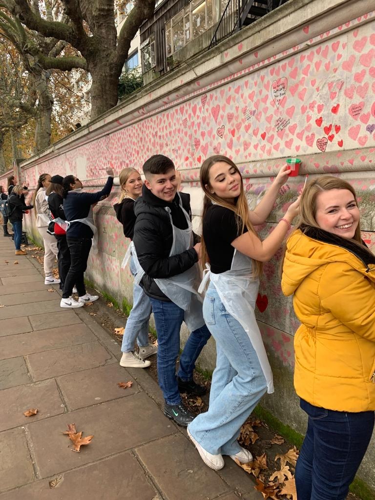 ShelfieldCA's tweet photo. Some of our students and staff had a very early start to the day in order to travel to London to help paint new red hearts on the National Covid Memorial Wall, last week. This is also in memory of Gareth Jones, a beloved member of our OAT family. @CovidMemorialUK @OrmistonAcads https://t.co/N2tp9QPx2k