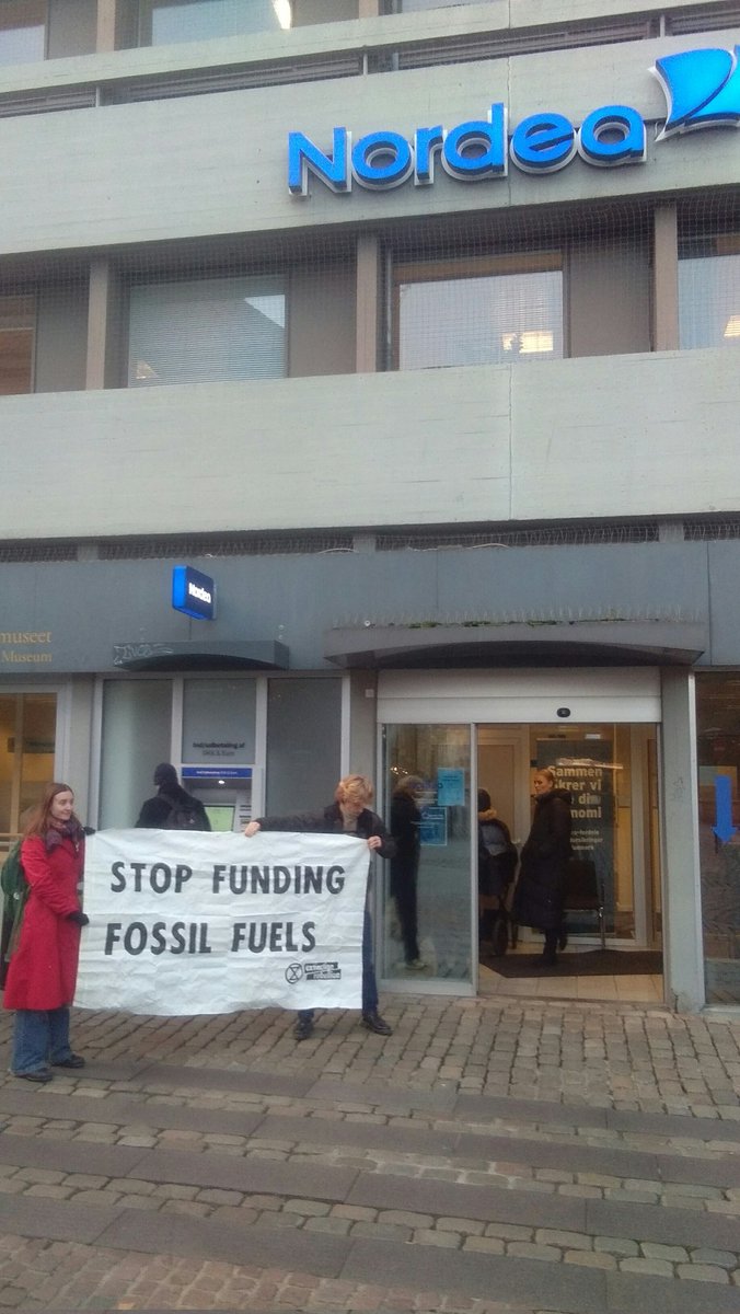 XRAarhus's tweet photo. NOW: together with @EstebanServat and @GlobalAktion we are in front of @Nordea to call out their climate crimes - Denmark's banks are still heavily funding fossil fuels! https://t.co/nOauHu73X4