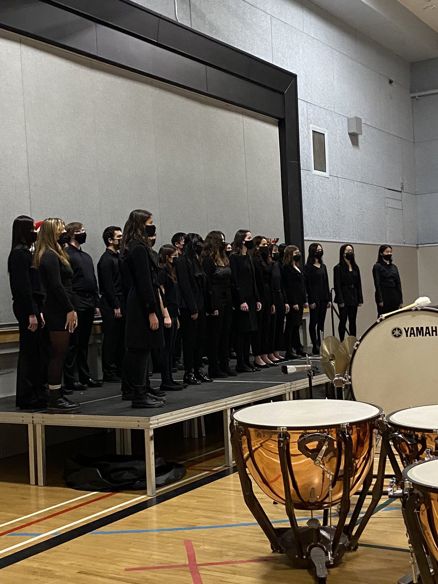 CristinaMcA41's tweet photo. We are so thrilled to be at half capacity tonight and have a live audience in our gym again! Our bands and choirs are stunning tonight and families are just sparkling with joy and pride.  Thank you, Mr. deSousa!  #cantstopwontstop @alphaSD41 @burnabyschools https://t.co/pgYUsYY1fI