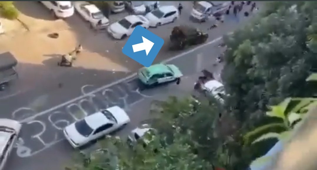 MayWongST's tweet photo. Uncomfortable, distressing image (sent to me) of protester pinned under #Myanmar #military vehicle after it deliberately drove, at high speed, into #Yangon protesters. Protester apparently dragged under as vehicle rammed into group staging flash protest #WhatsHappeningInMyanmar https://t.co/i0hy860olD