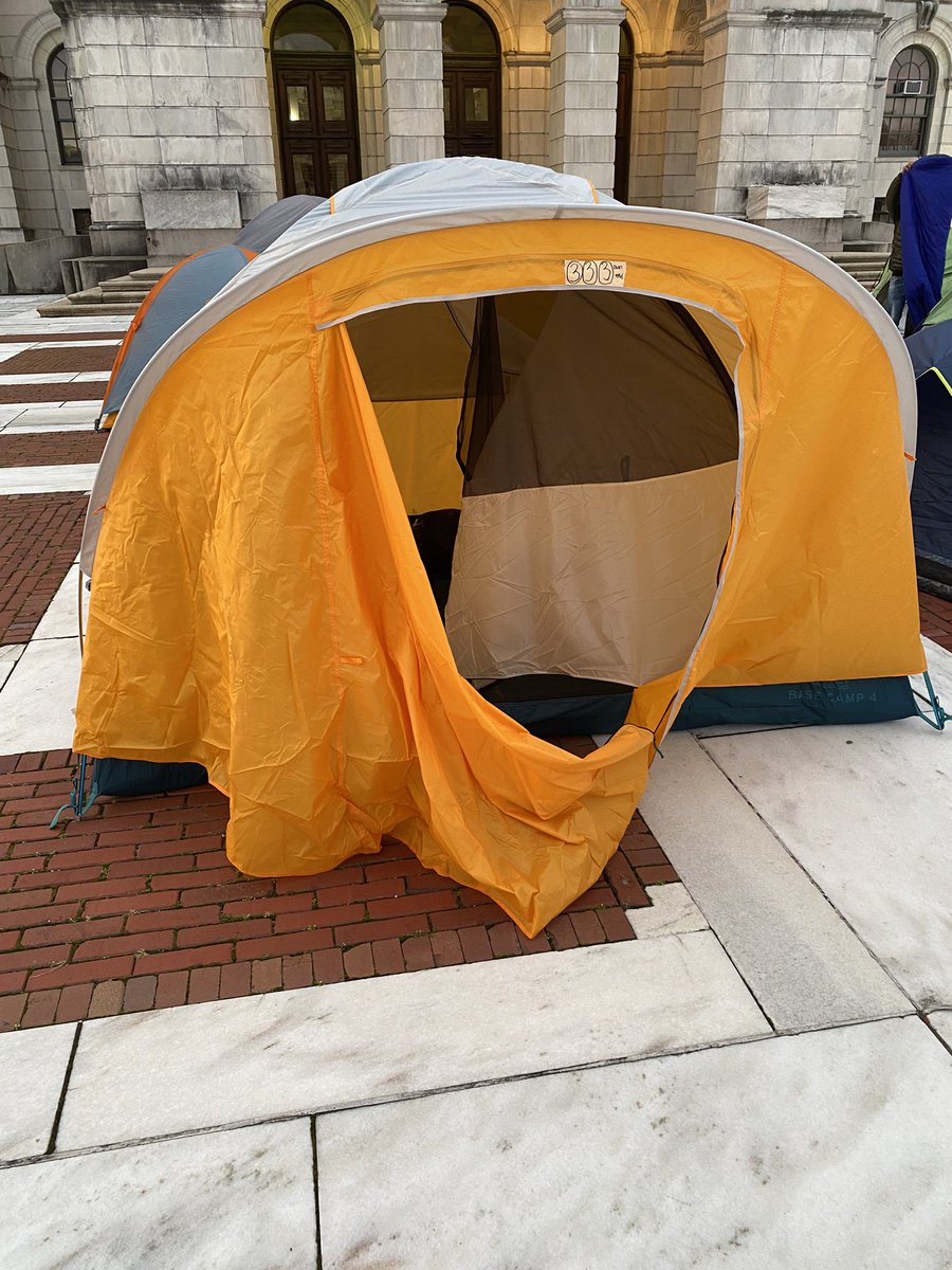 _HarrisonTuttle's tweet photo. Last night I made the choice to spend the night at #SleepOutRI. For our unhoused community in this state, that choice has been made for them. Their decision was made by @GovDanMcKee and @JoeShekarchi to let people freeze to death this winter, instead of ending homelessness. https://t.co/KmP7j7nUXV