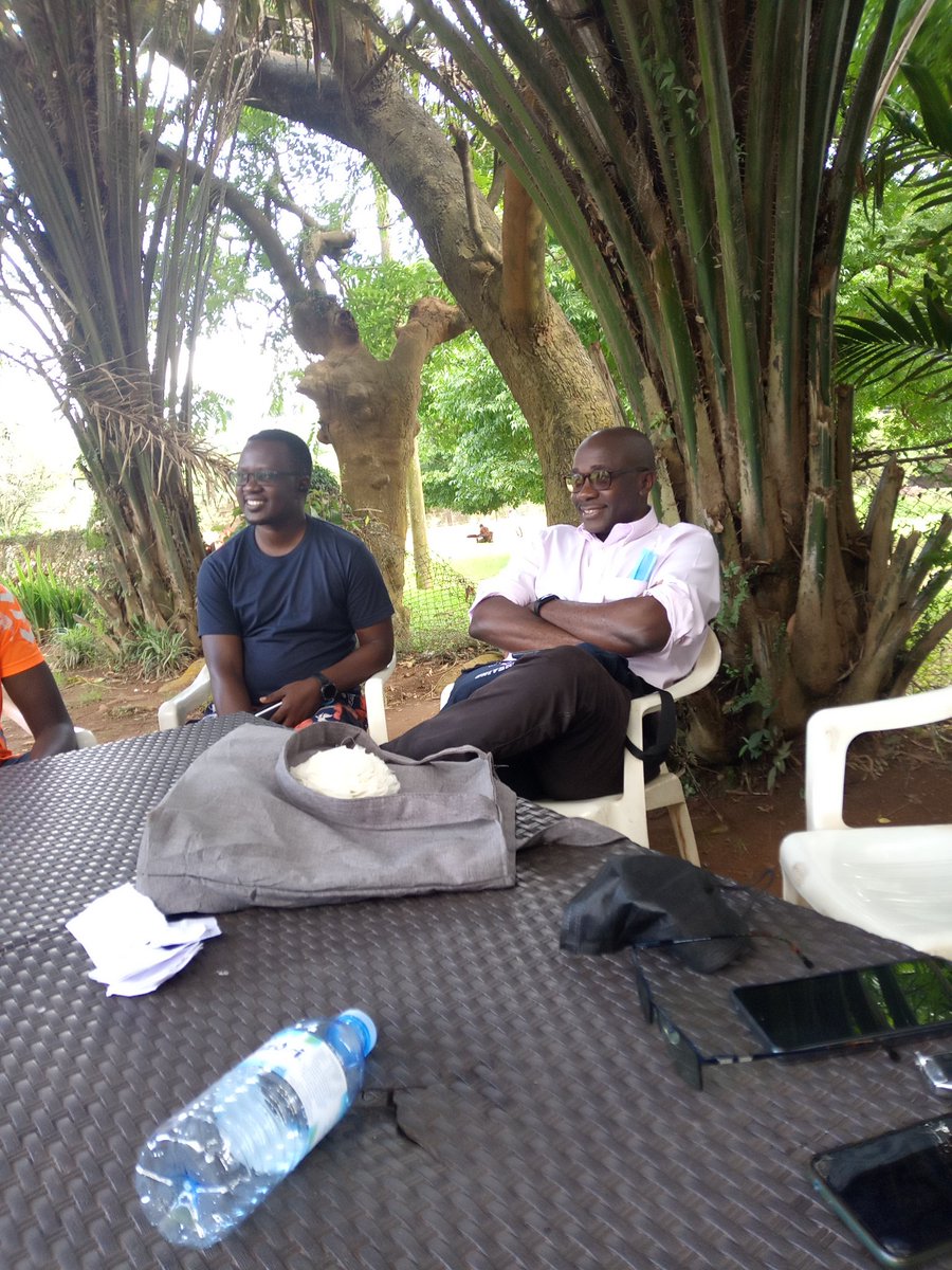 Outgoing P.E.N Uganda president Dr Danson Kahyana (right) at the general elections this afternoon.