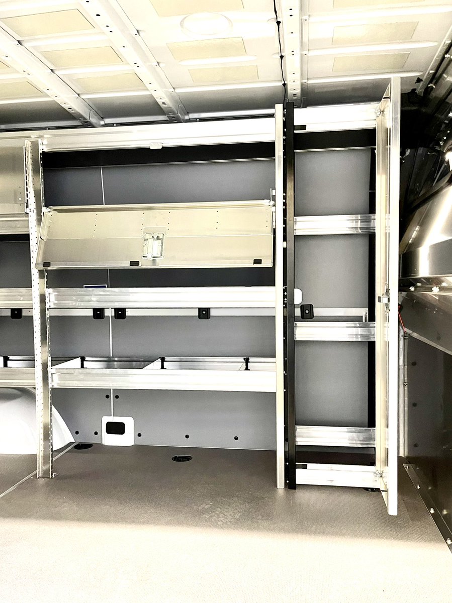 MobileColdSol's tweet image. Another 2021 @MBvansUSA Sprinter upfit with @RangerDesignInc components &amp;amp; a sliding door window. A contoured aluminum safety partition with window, shelving units with adjustable dividers, locker storage unit, locking shelving doors, partskeeper cases, bottle rack, and hook.