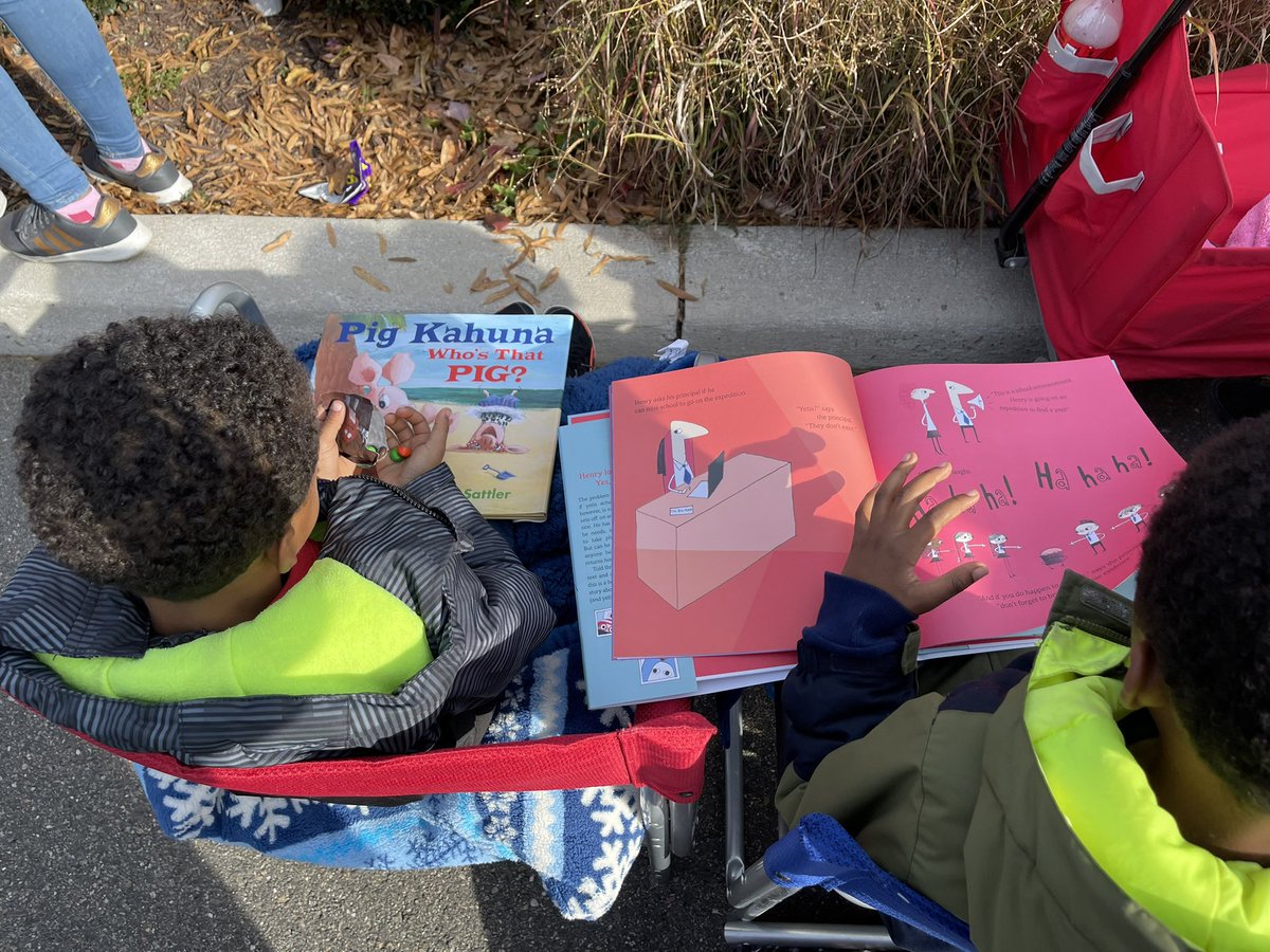 Shout out to the @LitLimo for passing out books during the Christmas parade! 📚 My oldest wanted to read his right away 😂 #LiteracyFirst #EvenAtTheParade