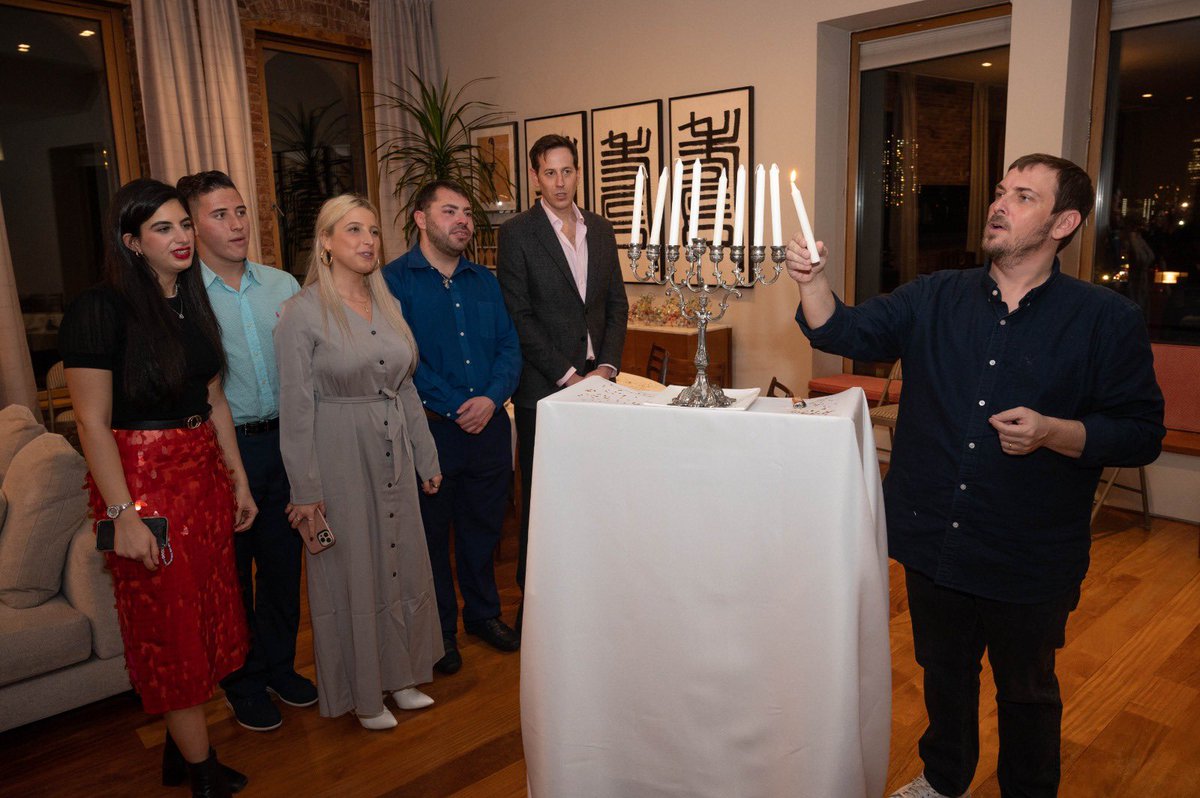 jacobkornbluh's tweet photo. Israeli Consul General @AmbAsafZamir lighting the menorah at Hanukkah reception for New York media at his residence in Manhattan 

📸 @ShaharAzran https://t.co/G0rqxdA3YS