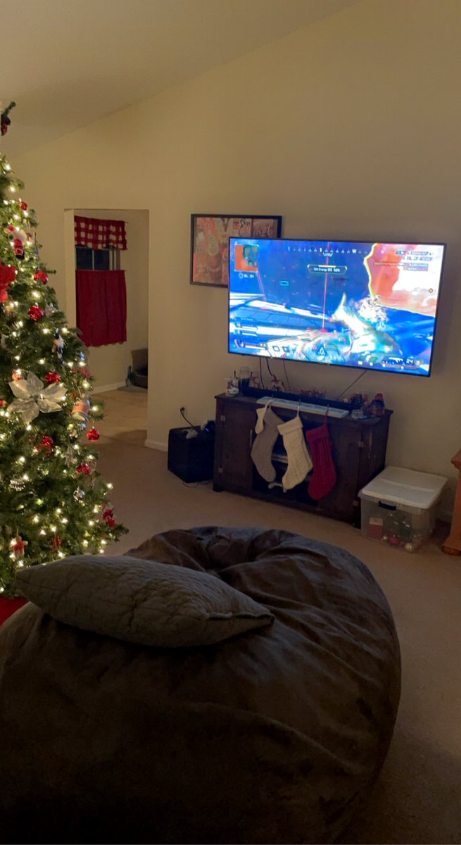 LoooolaB's tweet photo. I got my big ass bean bag chair, @PlayApex on the big screen, and the Christmas tree is lit! I am ready!!!! Letโs goooo boys!!! #ALGS #MyTeamIsBetter @sweetdreamsh1 @nafengg @rockerapex https://t.co/5rwcgMUeJG