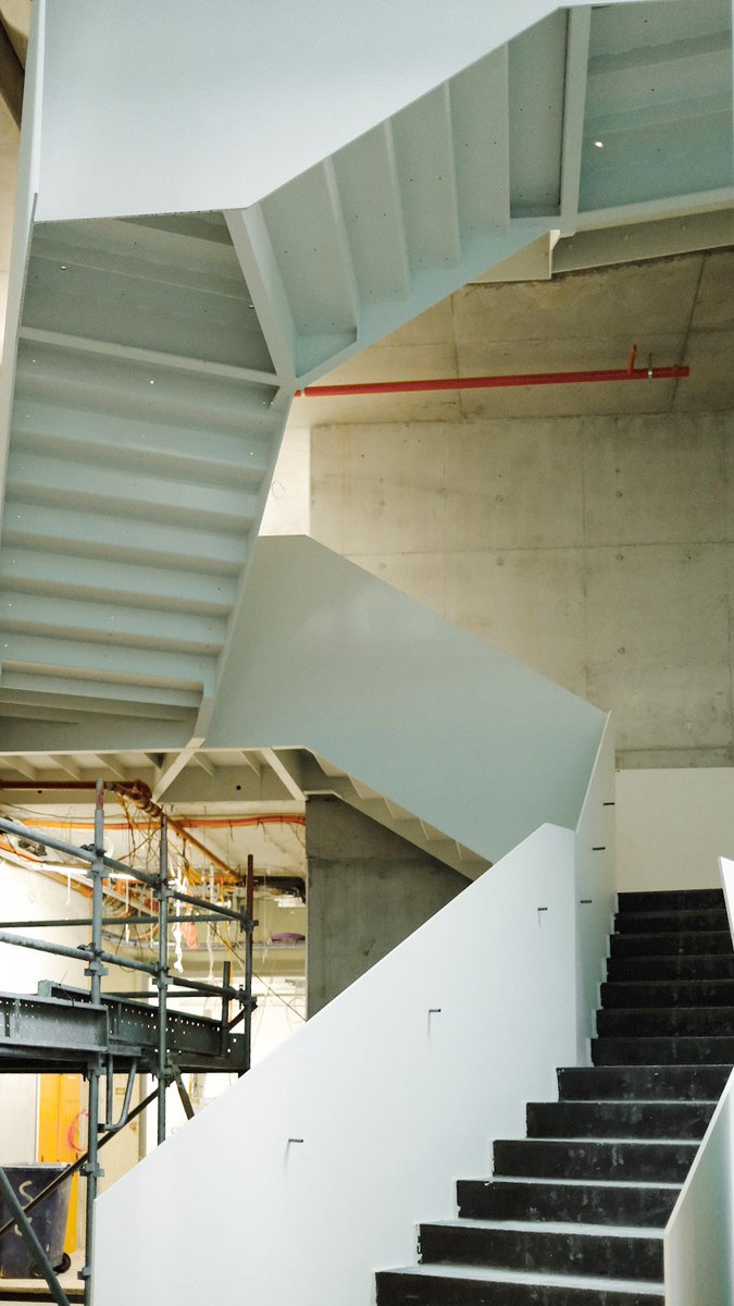 ConradGargett's tweet photo. On site at the Thomas Dixon Centre, Home of Queensland Ballet. The experience of this voluminous arrival space connecting the heritage building with the new addition is impressive even whilst under construction #conradgargett #thomasdixoncentre #queenslandballet #BuildingForQld https://t.co/negW90G3QL