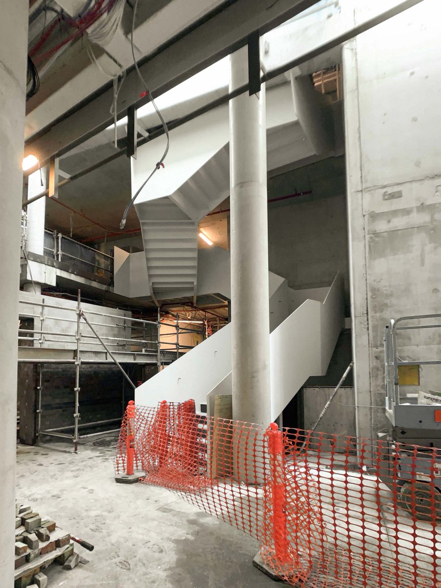 ConradGargett's tweet photo. On site at the Thomas Dixon Centre, Home of Queensland Ballet. The experience of this voluminous arrival space connecting the heritage building with the new addition is impressive even whilst under construction #conradgargett #thomasdixoncentre #queenslandballet #BuildingForQld https://t.co/negW90G3QL