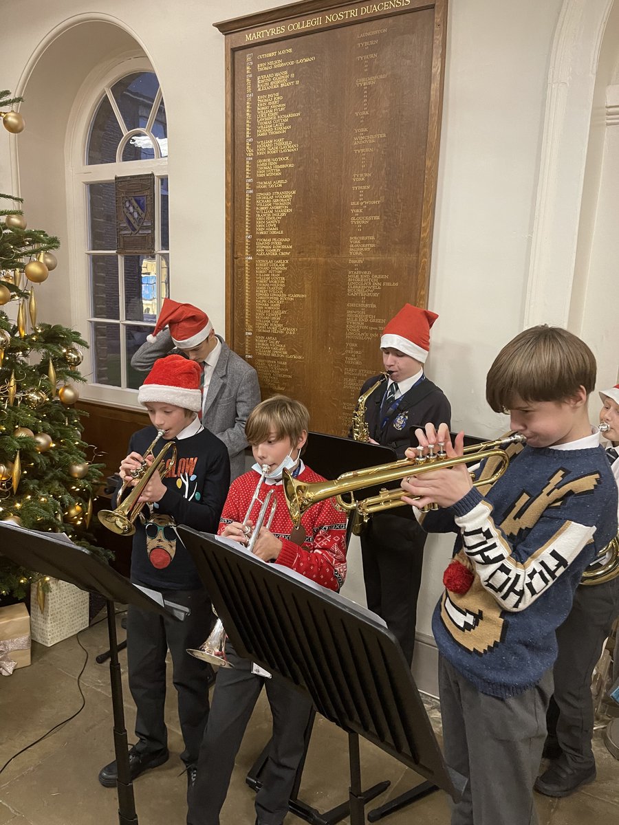 SECMusicSchool's tweet photo. We're getting into the #Christmas spirit with the Orchestra playing carols and festive tunes around the Christmas tree. #Carols #fun #ChristmasJumpers https://t.co/wRC7eBzgxO