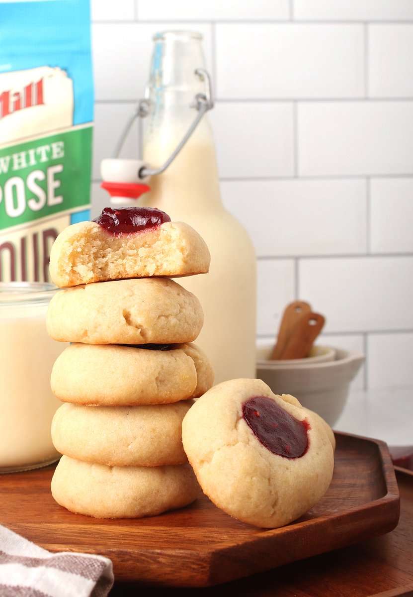 Vegan thumbprint cookies are perfect for any occasion! #ad Made with a buttery shortbread cookie and filled with jam, this classic cookie recipe is one to try this holiday season. Make this recipe with @bobsredmill AP flour for the BEST quality cookies! bit.ly/3dn3gBF