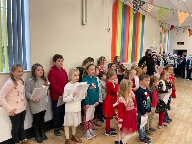 NCLT_Academies's tweet photo. Some of our Camelford Primary School Children singing at the annual Community Christmas Dinner for members of the public. https://t.co/CVah7uUDO1