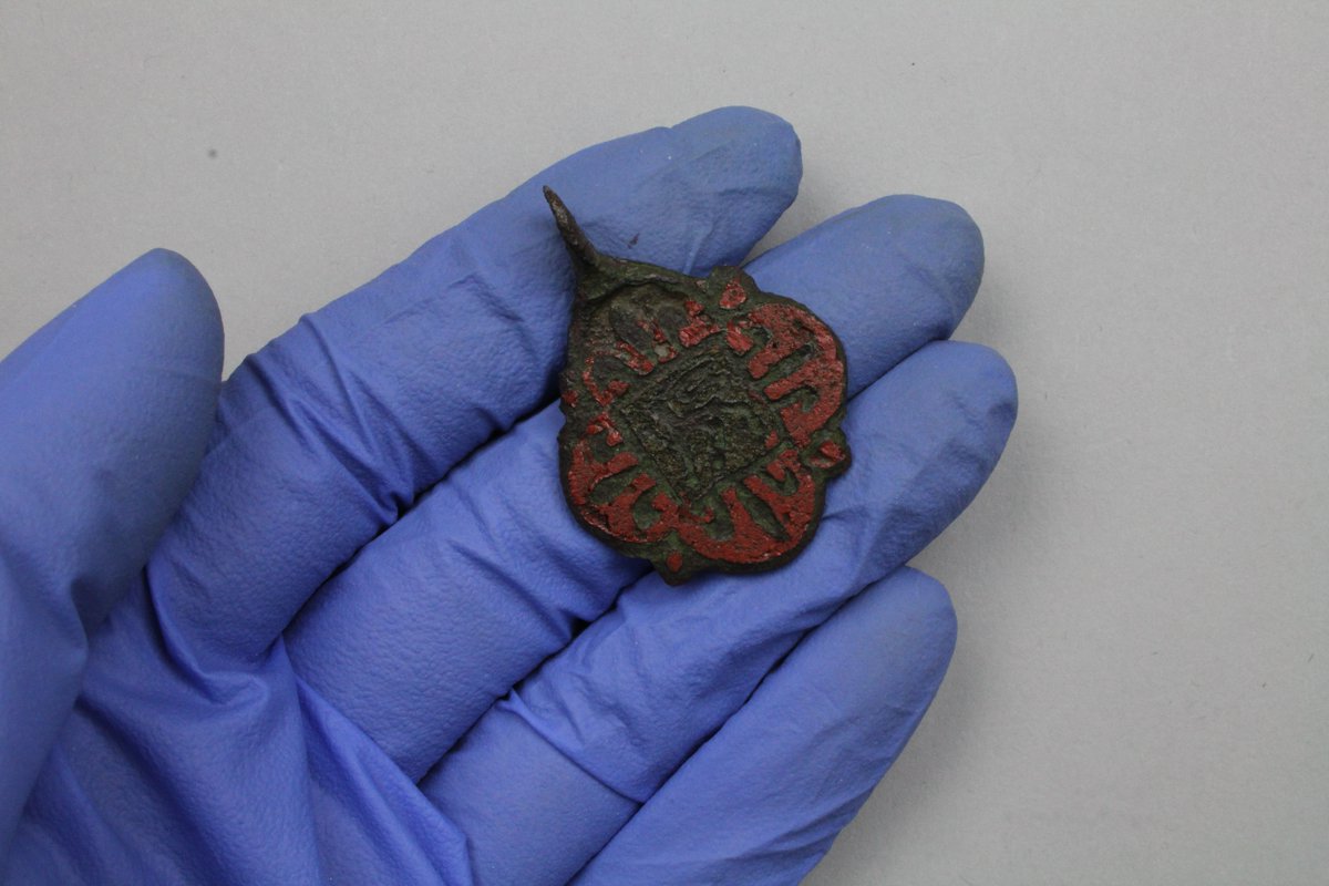 aocarchaeology's tweet photo. Day 9 of #AOCAdCal: this horse harness pendant 🐴retains plenty of its red enamel - it must have been lovely and bright back in the #medieval period! It's now sparkling and ready for display in Perth's new museum: https://t.co/85GOElO9sS @CPKMuseums @culturepandk @MuseumsGalScot https://t.co/bOyhK6uUvW
