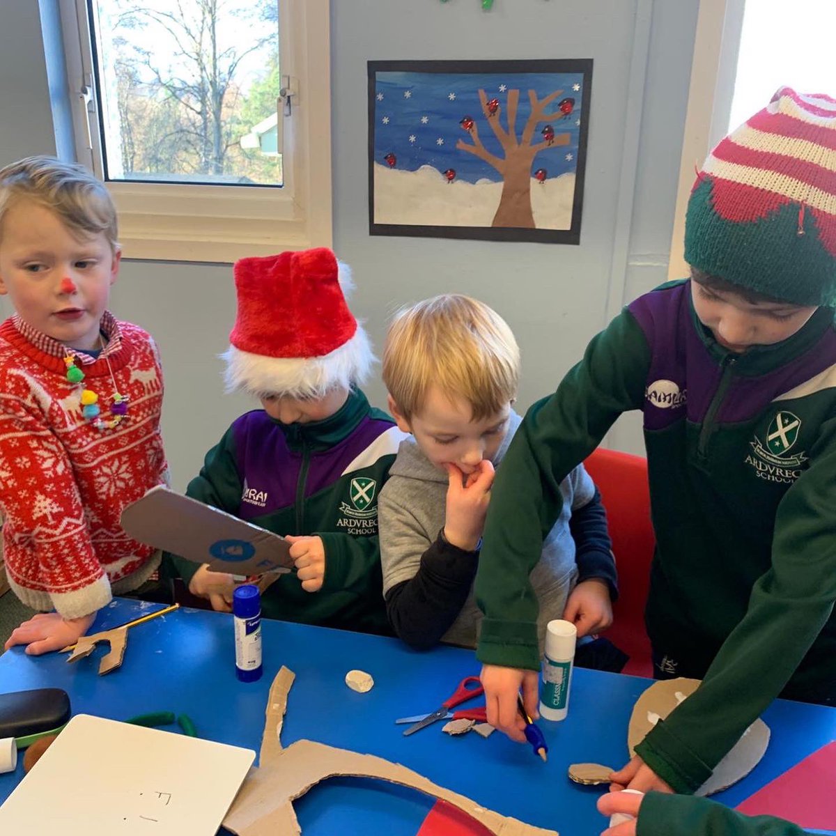 ArdvreckSchool's tweet photo. Pupils in Little Ardvreck welcomed their Nursery friends into their classroom last week. The children enjoyed a quiet story and some fun Christmas art. The older pupils worked wonderfully with the younger children, cutting, sticking and drawing. #collaberativelearning #art https://t.co/CCbep6i2G5