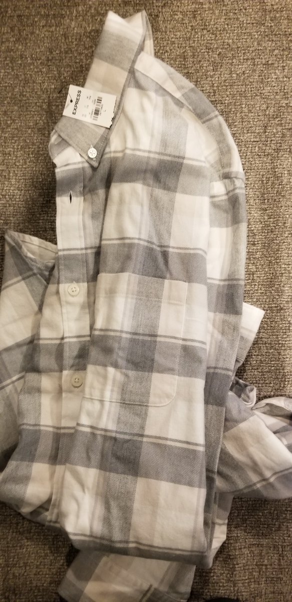 CheesecakeHey's tweet photo. @express I understand supply chain issues and fulfilling orders the best you can but I bought a Xmas present and the shirt was literally tossed into the mailing package, not packed, with the price tag already removed. It looks like it was tried on or returned then forwarded to me https://t.co/W5z4Mc9a6l