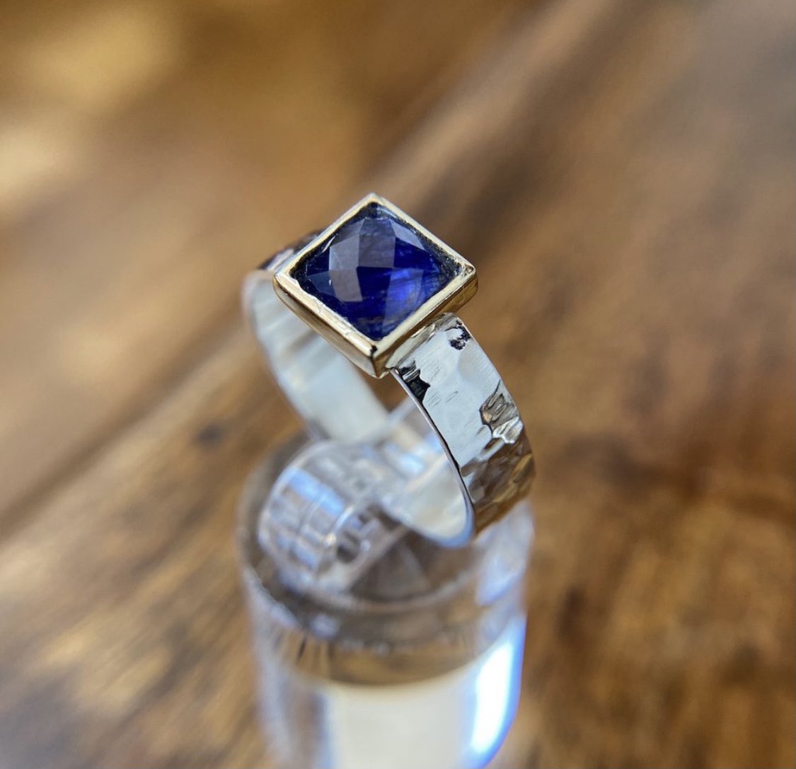 First Dance Sapphire Ring

Cushion cut sapphire embraced by 9 carat gold setting does a slow waltz. Handcrafted hammered shiny sterling silver with 9 carat gold. Dainty and elegant, this solitaire blue sapphire ring is crafted in 9ct yellow gold and sterling silver. #yaronmorhaim
