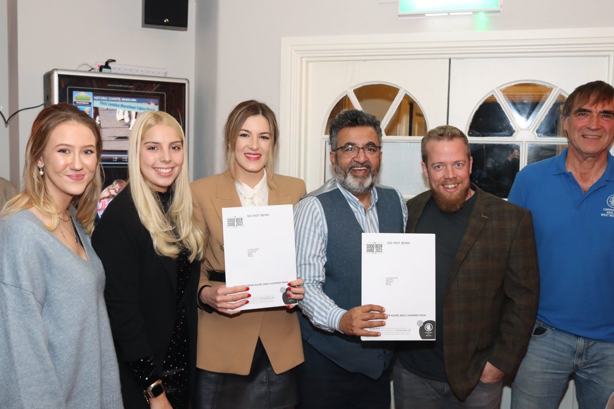 The King Charles Tavern, Newbury &amp; The Great Shefford
from 2nd left: Grace Webber (KCT), Georgiana Caras, Joshua Khan &amp; Sam Cary (GS) receive Good Beer Guide 2022 documentation from West Berkshire CAMRA Chair - Andy Pinkard
(at the Lion, Newbury 22/11/21 photo: Richard Lock)