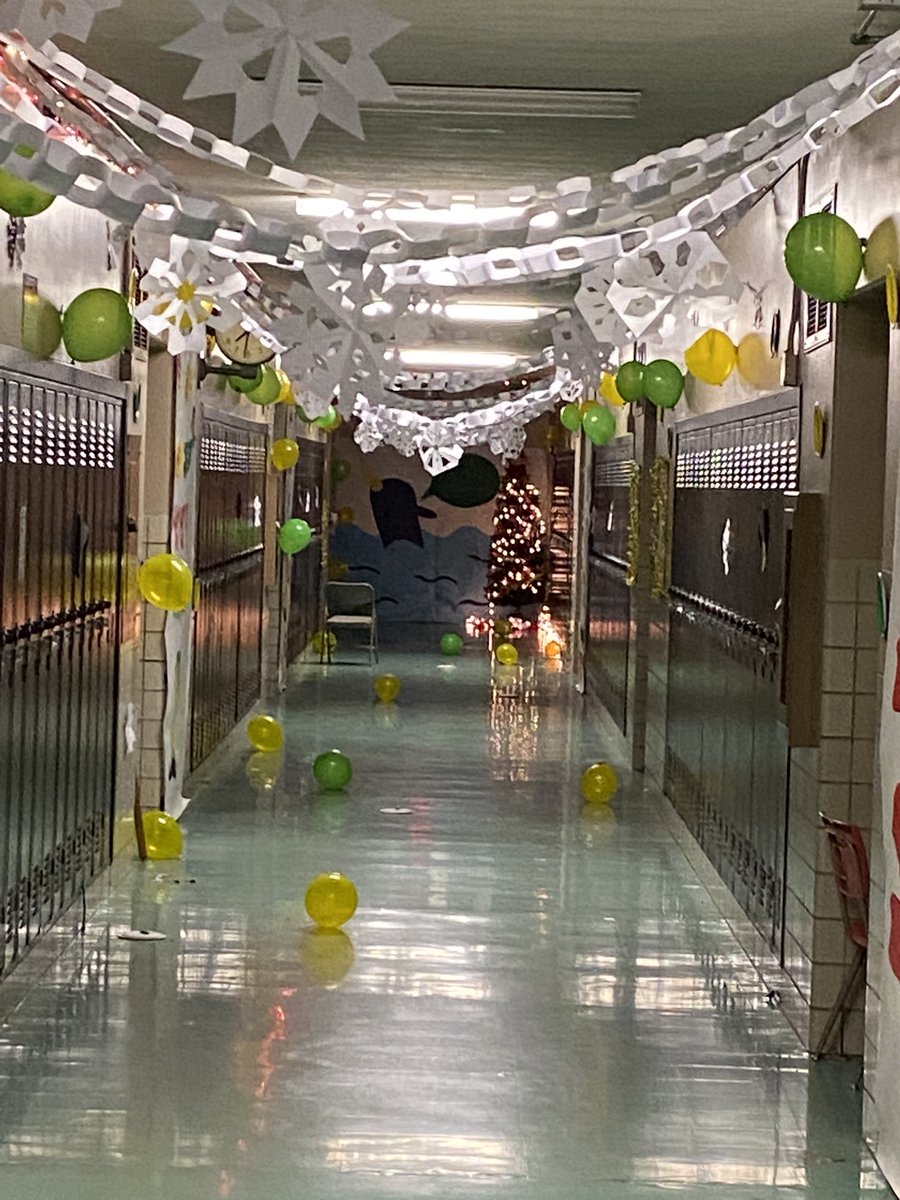HarrisMath314's tweet image. I am lucky to “live” in this hallway everyday. I love the paper chains and snowflakes, but the narwhal by my classroom is my favorite part.