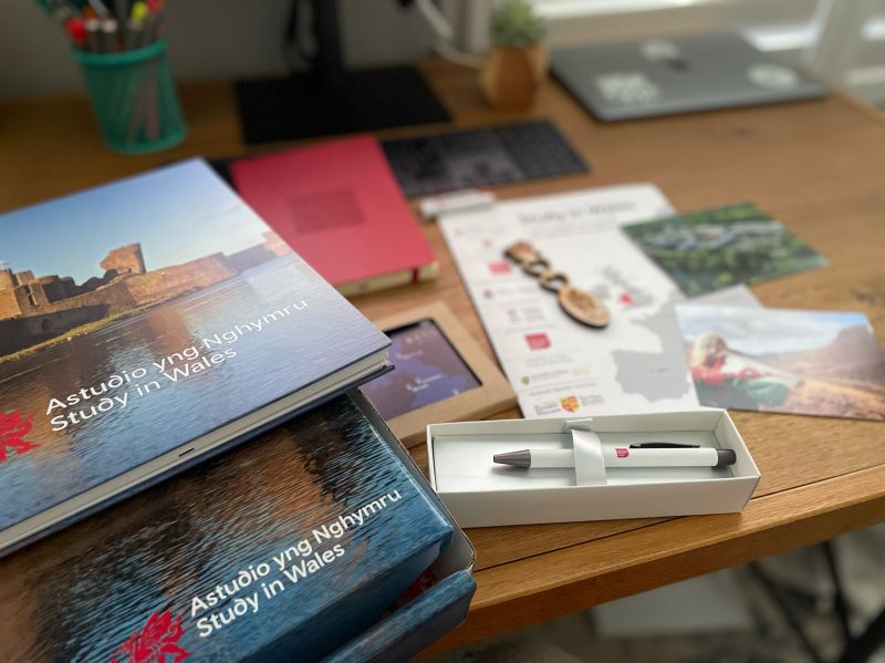 UniAppsAbroad's tweet photo. Wow, I am feeling spoiled this week, and it’s not even Christmas! Loved receiving this box of goodies from the @studyinwales team, as well as lots of useful info on universities in Wales! Thanks again, friends! Hope to see you in 2022! https://t.co/20pfYSwgPu