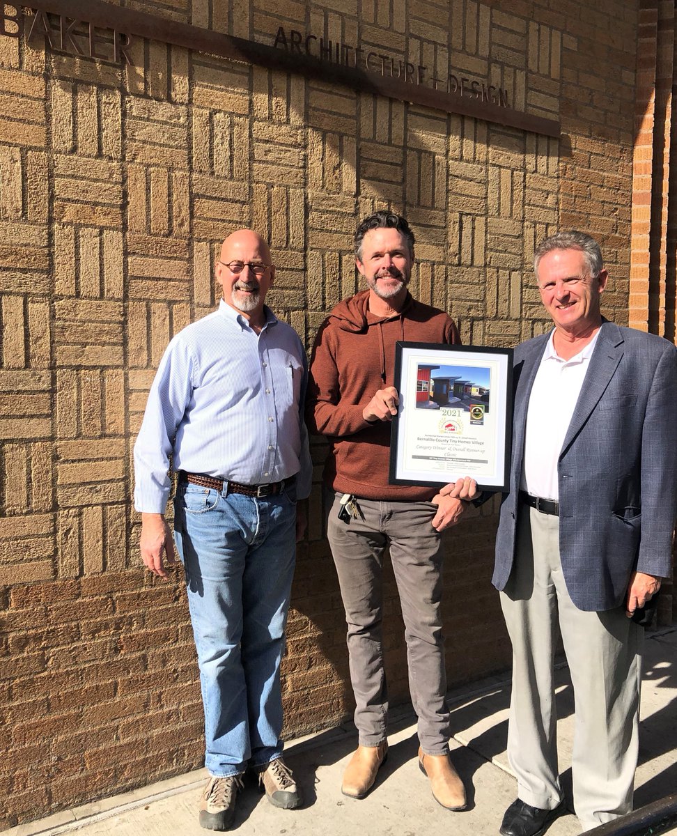 ENERCEPTINC's tweet photo. Enercept Independent Dealers Jon Wagar (left), and David Cappel (right) presenting a copy of the 2021 Building Excellent Award for the Tiny Home Village to Architect, Mark Baker (center).  Learn more about the Tiny Home Village: https://t.co/DhQNMqL8vb https://t.co/OrNgS6OFpx