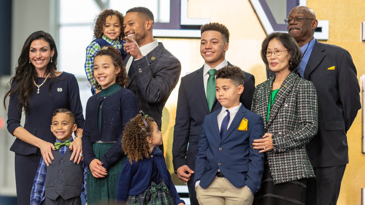 PFF_College's tweet photo. Notre Dame’s new head coach Marcus Freeman, son of a Black Air Force veteran father and Korean immigrant mother, thanked his family, staff and players at his first press conference, per @angdicarlo. https://t.co/fhkFm4bv4T