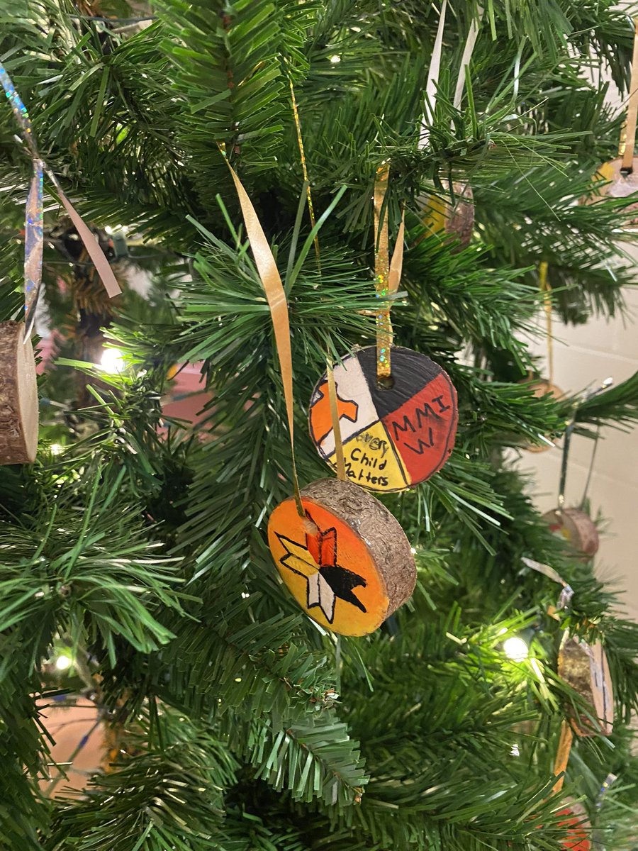 TMS Grade 8 artists (with some help from a few grade 5s) decorate TMS Nuelewimkewey Stoqn (Christmas Tree) with Every Child Matters and Mi’kmaq inspired tree cookies.