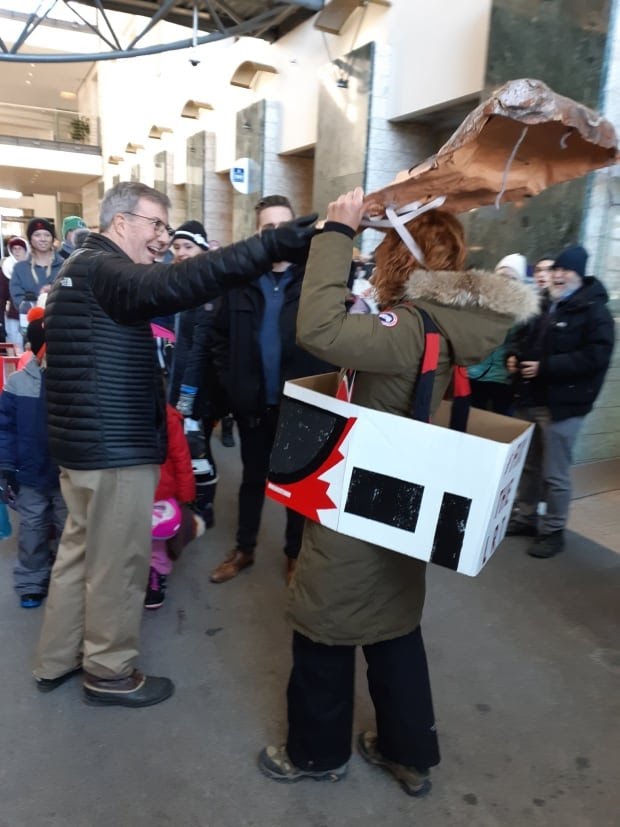 PoliticalHeads's tweet photo. @JimWatsonOttawa @DiasporaOttawa This was a peaceful protest. I wore a mask of your face and a #FixTheLRT costume. You are smiling, yet a crazed look in your eyes. You don't need 2 people to lift off a mask- mine were there as a reaction to this assault. https://t.co/pXbZ5mv0Jr
