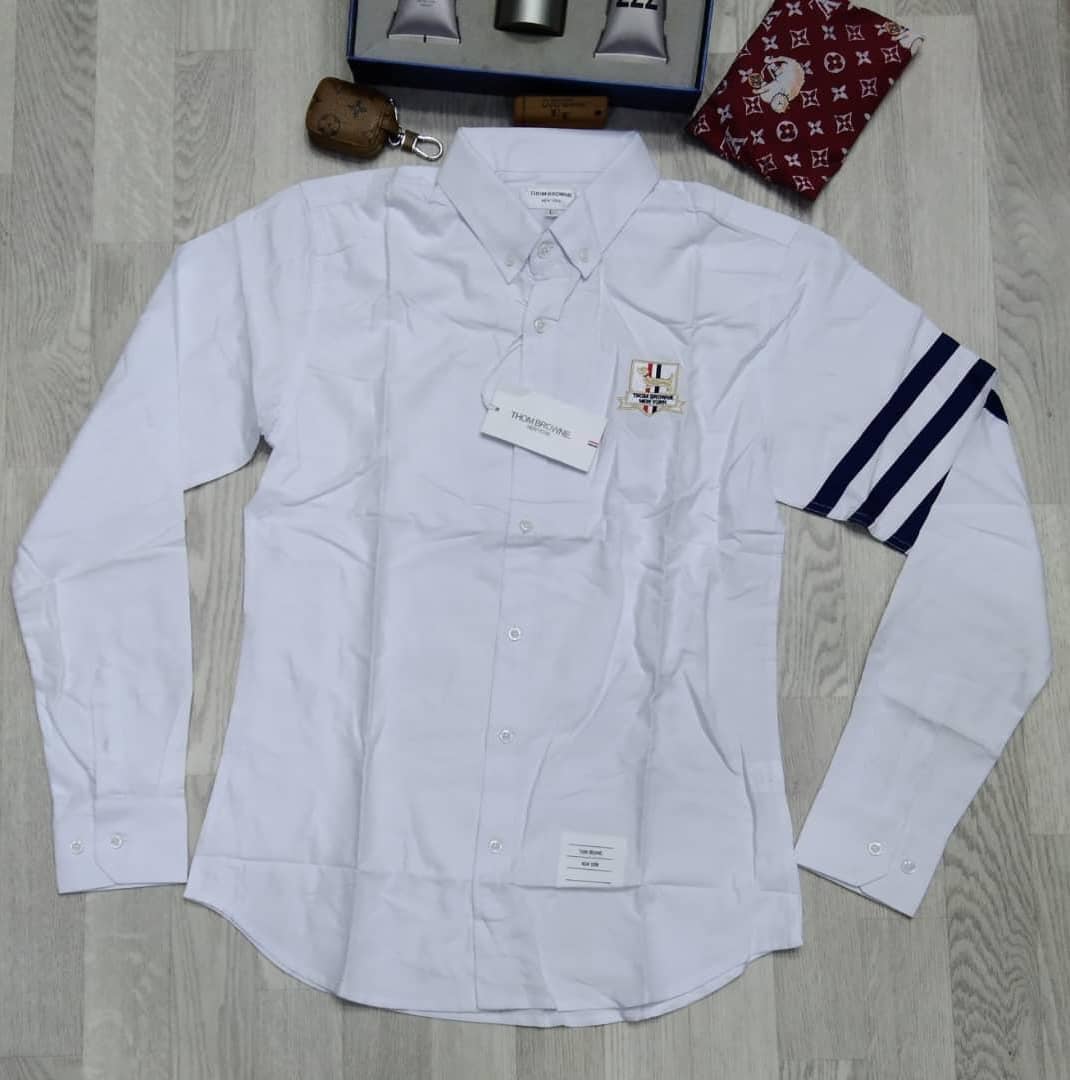 Indulgence_stor's tweet photo. @aproko_doctor THOM BROWNE Pin Down Dress Shirts available in exciting colours. 
Price: N17,000
Location: Lagos
Nationwide delivery. 
Send a DM/Whatsapp: 08187261604
Kindly retweet. Thank you. https://t.co/FIfV2Jz7ee