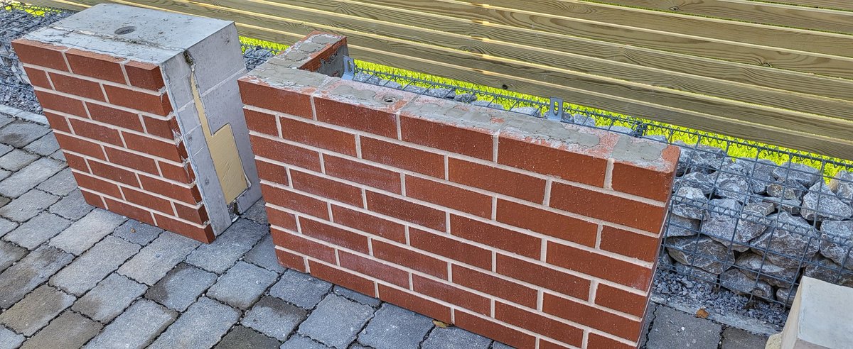 Built using closed panel timber frames and even the brickwork was prepared offsite. No bricklayers were used. 
Roof was built on the ground with PV and batteries integrated then lifted into place. Energy balance with the grid is monitored.