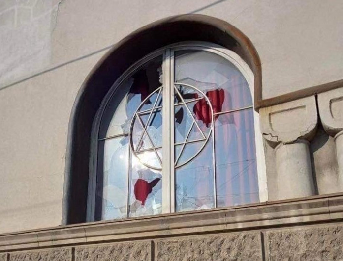 StandWithUs's tweet photo. Horrible! A building belonging to the #Jewish Cemetery in Belgrade, Serbia was vandalized yesterday. An ax was also found on the floor next to the shattered glass from a broken window damaged during the attack. Local police are investigating the incident. 
#StandUpToHatred https://t.co/mlWhPPBi7X