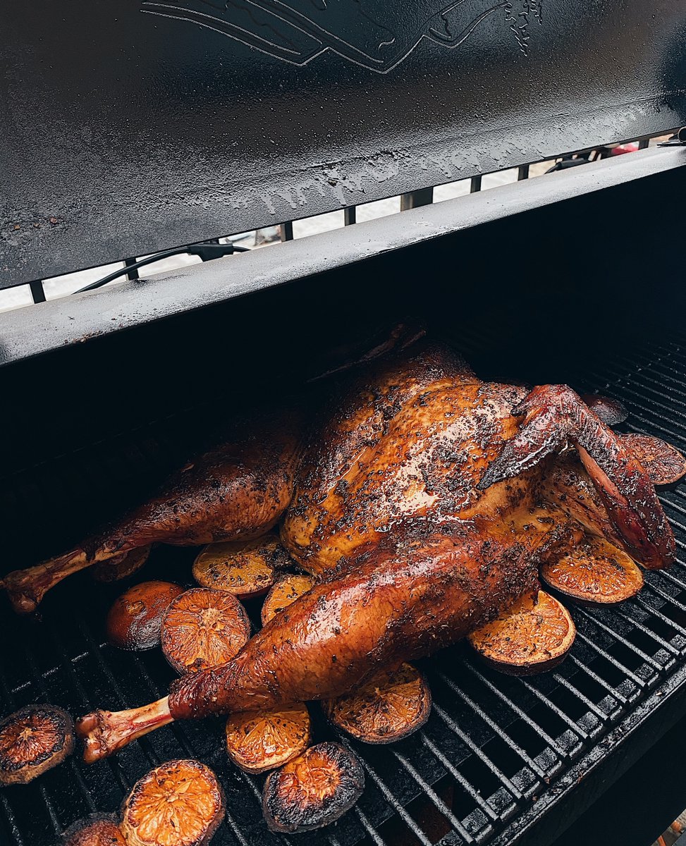 This is a spatchcocked turkey I made that was in a orange and whiskey brine overnight and then smoked on a bed of cara cara oranges on my <a href="/traegergrills/">Traeger Grills</a>. This was my first time doing this method and it turned out incredible!
