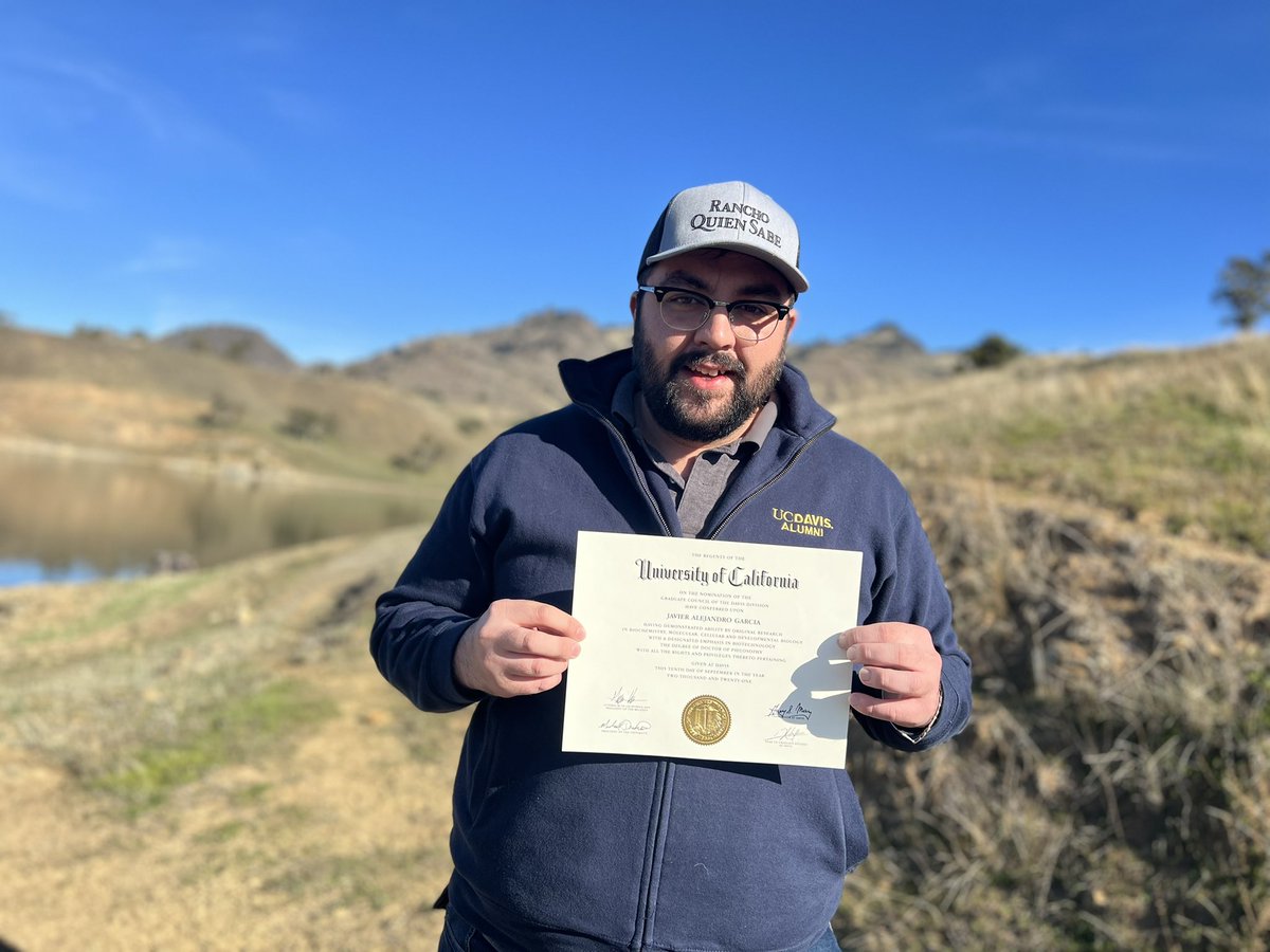 I *officially* have my PhD! It’s pretty surreal holding it on the cattle ranch I worked on especially when #ValleyFever hides in the very mountains behind me. (Yes that’s the name of the ranch on my hat, ironic no?) #SiSePudo #SoyDeRancho @ucdavis @CalStateLA @Fresno_State