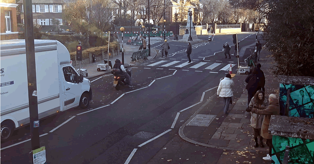 webcamsmap's tweet photo. As usual its a busy at @AbbeyRoad famous zebra crossing https://t.co/kwCoWwQmTh. Oddly though on the day when #TheBeatlesGetBack is released on @DisneyPlusUK the cam shows it closed by barriers This hasn't stopped faithful fans from recording their visit to the famous crossing https://t.co/yKoEJ590K3