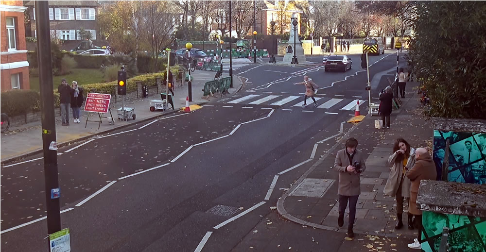webcamsmap's tweet photo. As usual its a busy at @AbbeyRoad famous zebra crossing https://t.co/kwCoWwQmTh. Oddly though on the day when #TheBeatlesGetBack is released on @DisneyPlusUK the cam shows it closed by barriers This hasn't stopped faithful fans from recording their visit to the famous crossing https://t.co/yKoEJ590K3