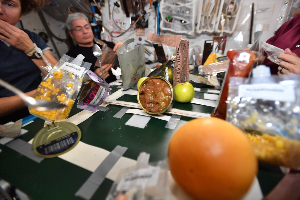 astro_matthias's tweet photo. One of the best things about international collaboration? Sharing international celebrations and culture 🥳 I'm thankful for all my crew mates up here on the @Space_Station and everyone supporting our mission from #Earth 🌍 #HappyThanksgiving  #ThanksgivingDinner #CosmicKiss https://t.co/9U9wAO6wHO