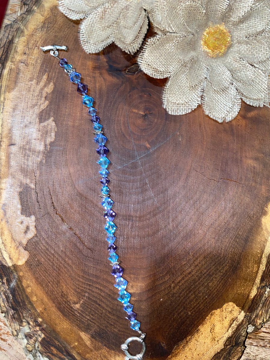 PowerBirdy's tweet photo. Blue Swarovski crystal all natural bracelet handmade. It glimmers in the light and it makes the perfect Christmas gift! Carefully hand made.  #swarovski #handcrafted #Christmasgifts #bracelet #jewelry #sale #bestgift #NaturalBeauty #Trending #vsco https://t.co/fNsUfdNE41 https://t.co/ltjFEIbdJX